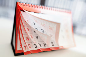 Months and dates shown on a calendar. Get an inheritance advance fast from InheritNOW.