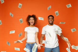 A young man and woman overjoyed about inheritance funds.